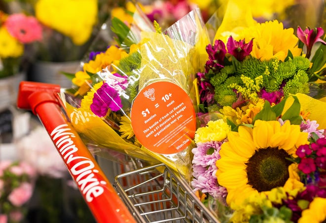 Bouquets of flowers are pictured at a grocery store.